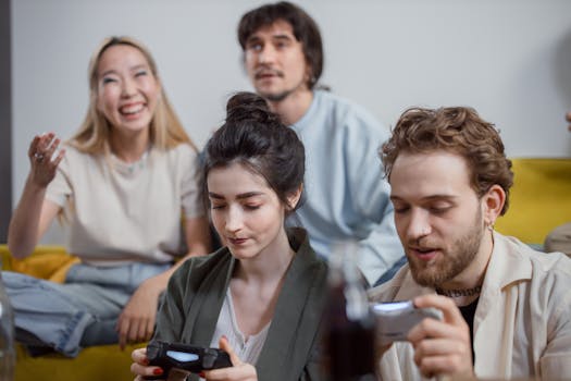 Group of diverse friends having fun playing video games in a relaxed indoor setting.