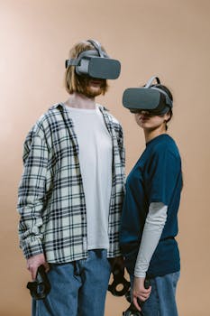 Two teenagers engaging with VR headsets, exploring virtual worlds indoors.